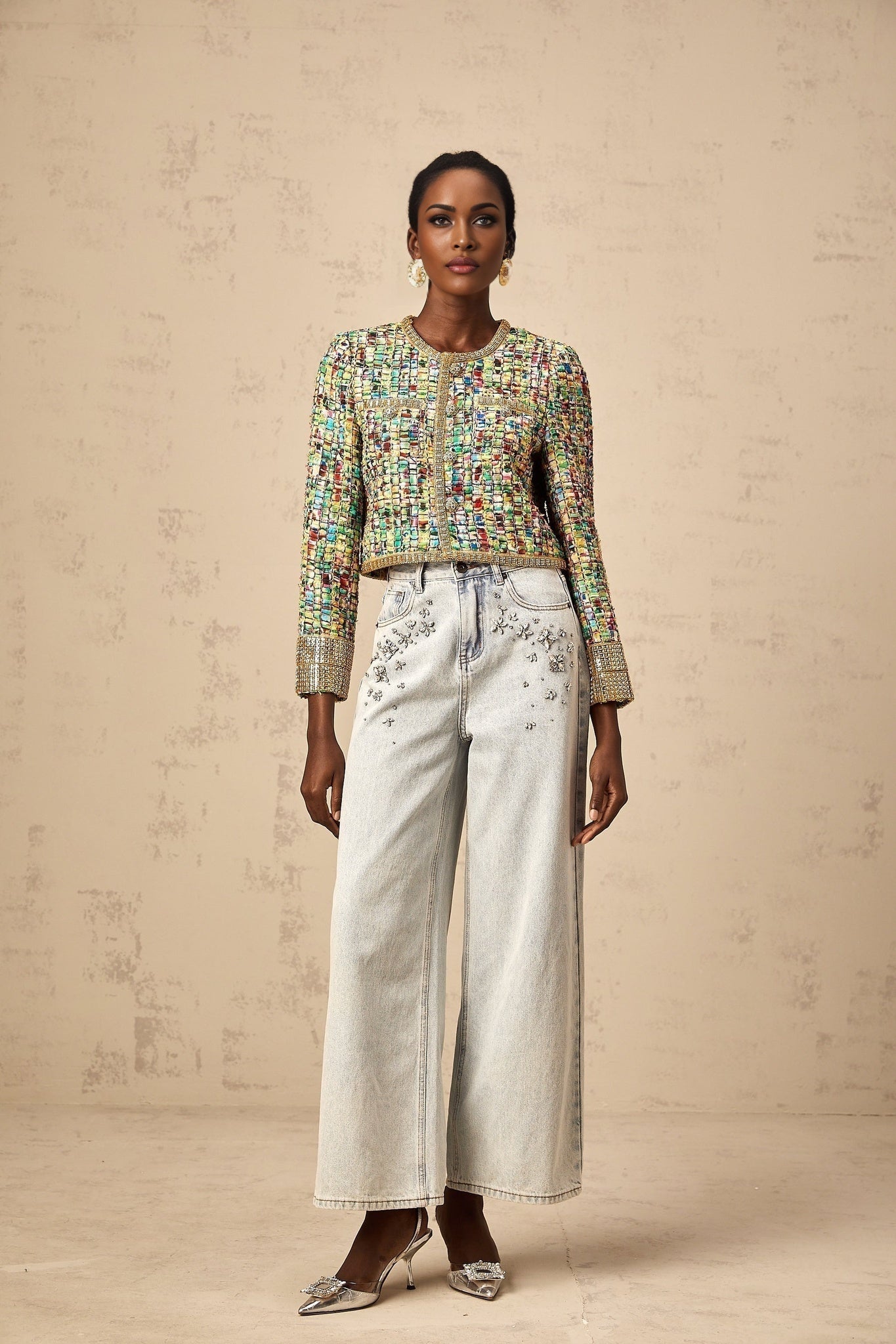 A goldtoned tweed jacket with a checked pattern and sequin embellishments