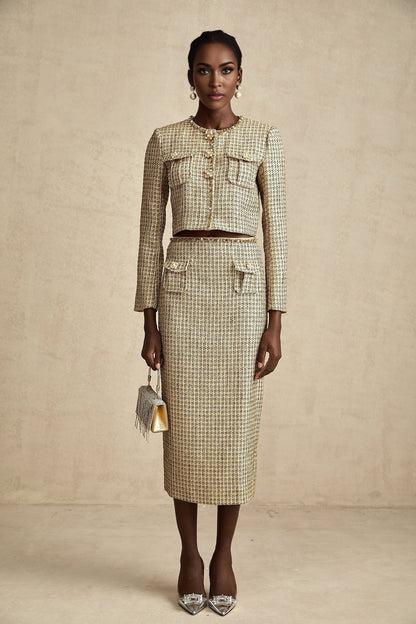 A stylish gold tweed jacket and skirt set with sequin embellishments featuring a matching ensemble for an elegant look