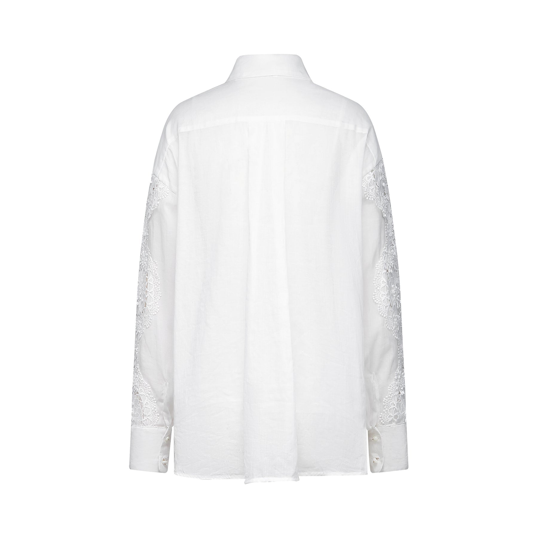 White sleeveless blouse with lace embroidery details and cutout design