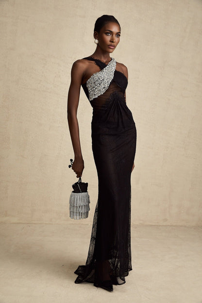 A black maxi dress with a crossover bodice featuring crystal embellishments and a long flowing skirt