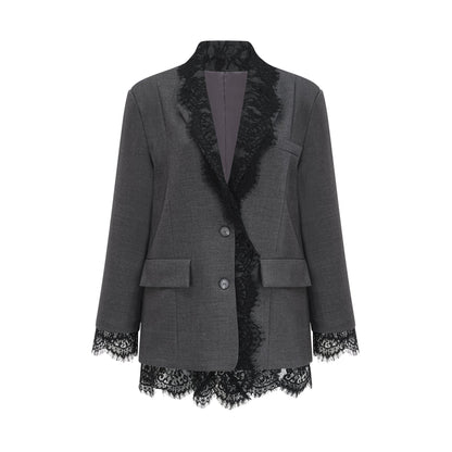 Woman wearing grey blazer with lace panel details on sleeves and lapels