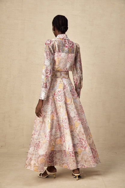 A cherry pink matching set featuring a patterned shirt and skirt with a floral or fruit print design