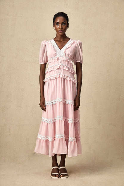 A pink midi dress with ruffled tiers and a feminine silhouette named Amelie