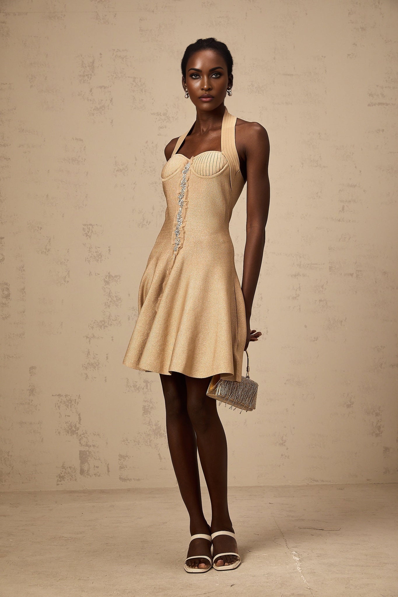 A khaki colored mini dress with a knitted texture and embellished details named Gabrielle