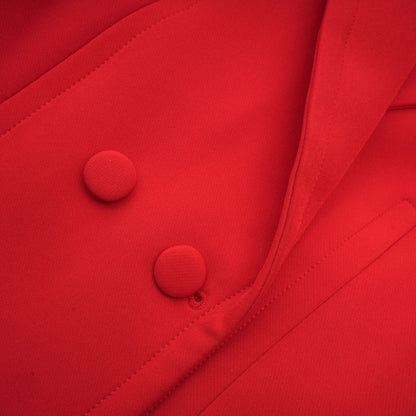 A red blazer with hourglass silhouette and doublebreasted front closure