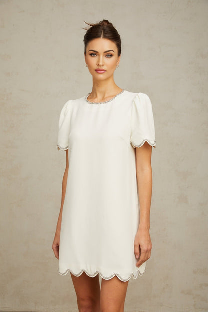 A short white mini dress adorned with crystal embellishments named Berenice