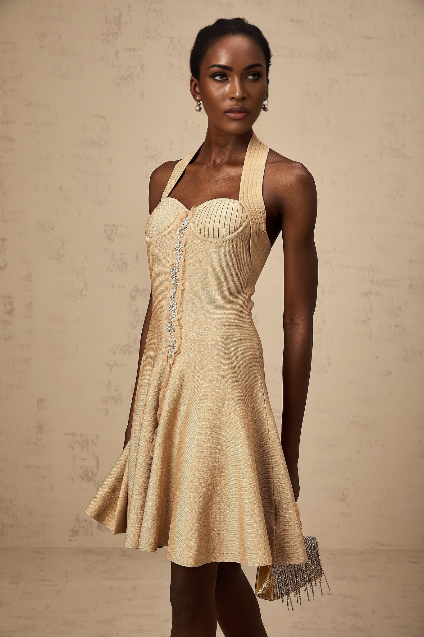 A short khaki colored knitted mini dress with embellishments named Gabrielle