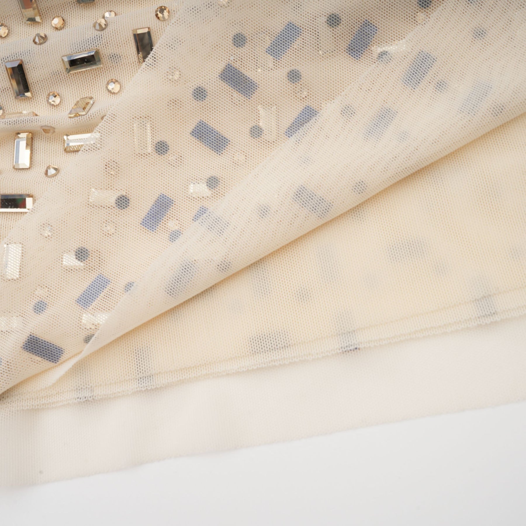 A short sleeveless mini dress with crystal embellishments and draped fabric details named Noémie