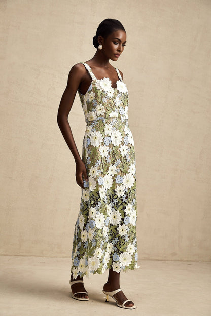 A midi dress with floral embroidery and hollowcarved details named Carla featuring a delicate pattern and intricate cutout design