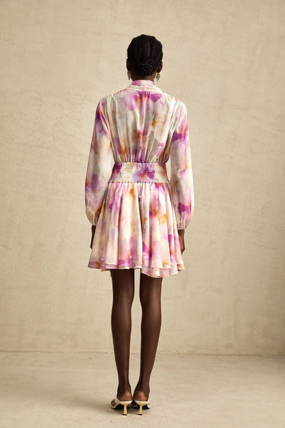 A short floral print mini dress with a V neckline in the Maelys style