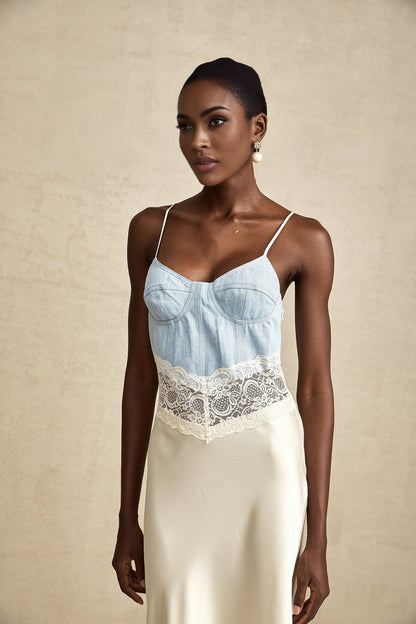 A long elegant maxi dress with lace trim and panels featuring a feminine silhouette in a flowing fabric