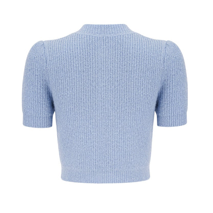 Woman wearing a blue knit matching set consisting of a blouse and skirt Chantal style outfit in a soft knit fabric