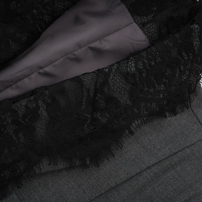 A grey blazer with lace panel detailing featuring a tailored silhouette and elegant design