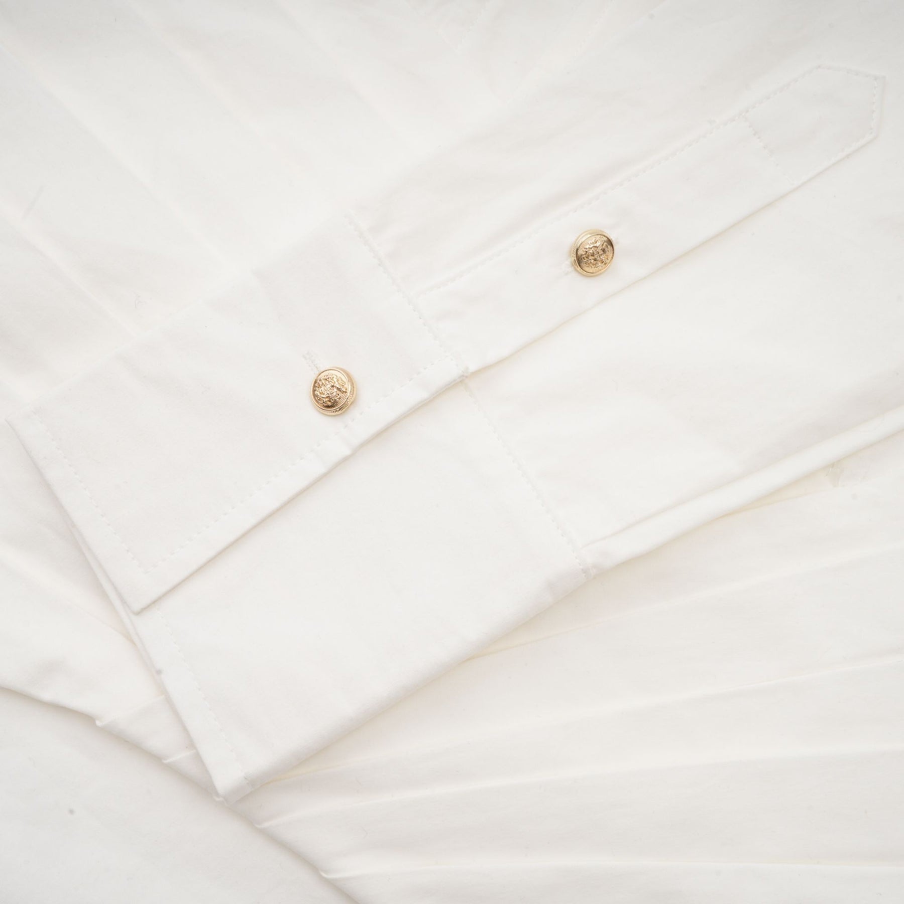 Alt text White pleated mini shirt dress with fitted waist by Orlane
