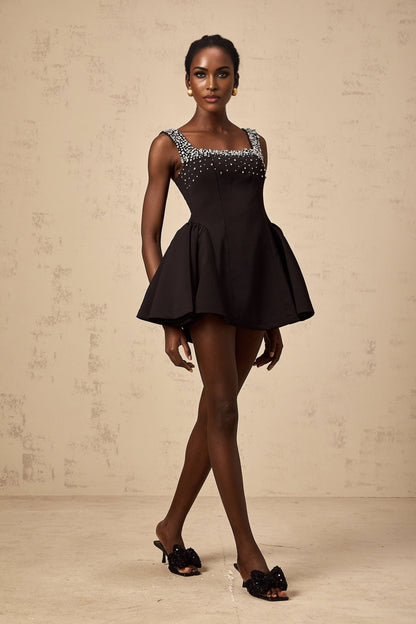 Black mini dress with flared skirt and crystal embellishments