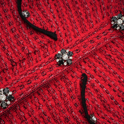 A red knitted midi dress with embellishments named Faustine featuring a form fitting silhouette and decorative details