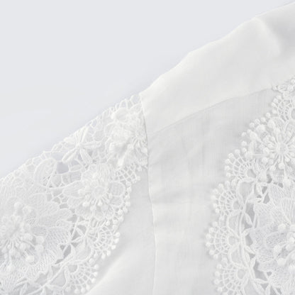 White long sleeve shirt with lace embroidery detailing and cut out design on shoulders