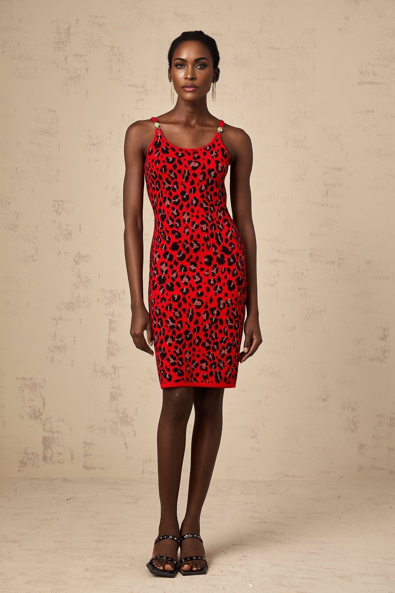 A short red mini dress with a shiny leopard print pattern made from lurex fabric