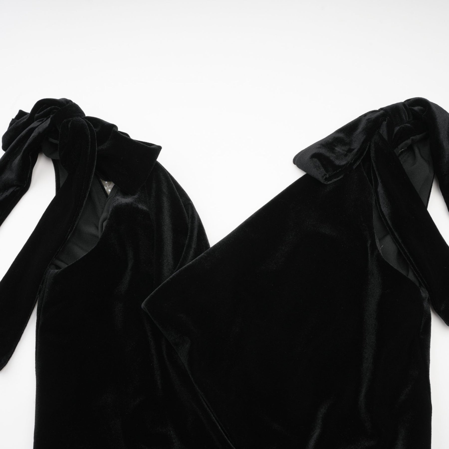 A long velvet maxi dress in dark color with an open back and embellished details named Audrey