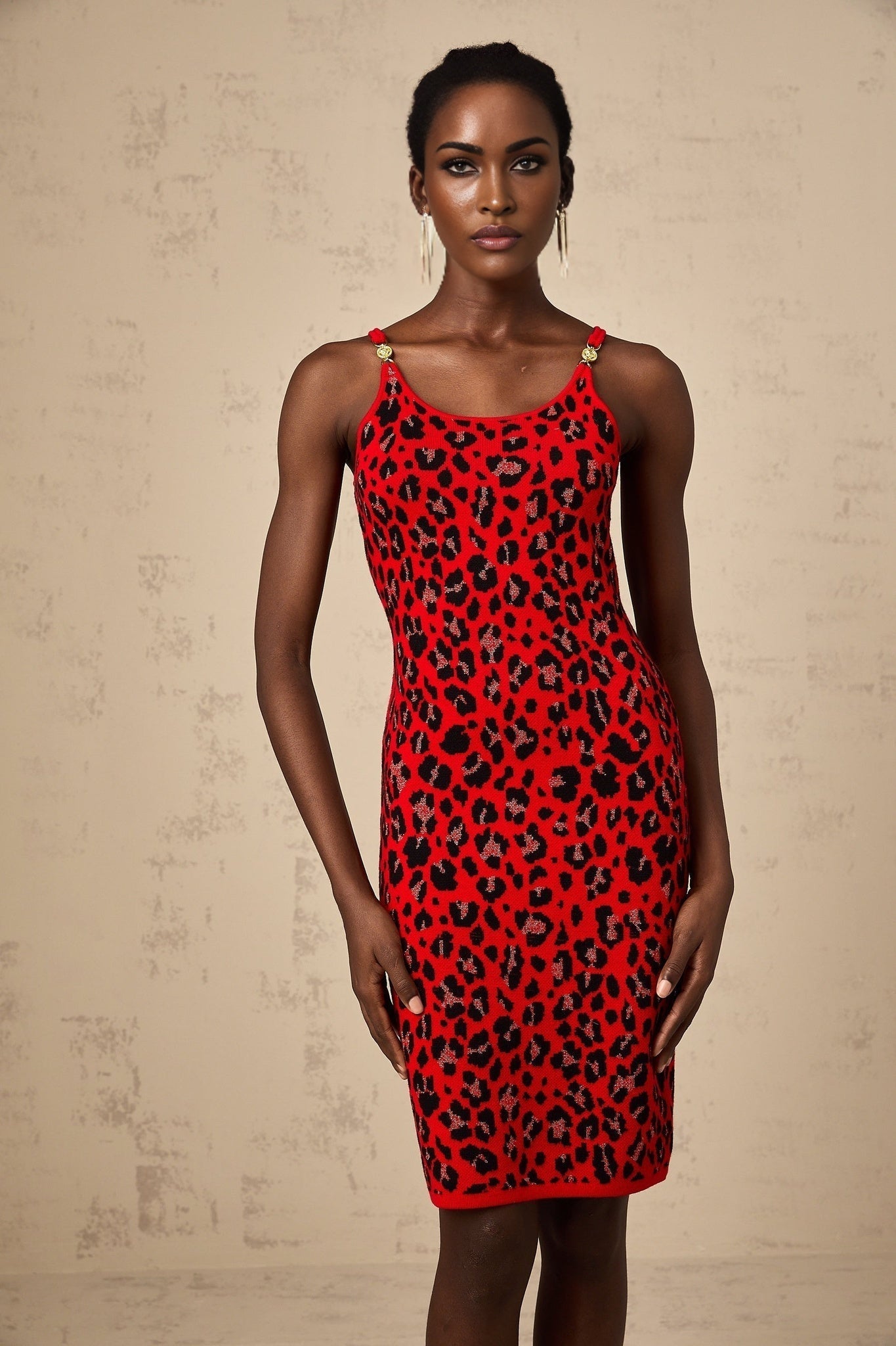 A red mini dress with a leopard print pattern made from shimmering lurex fabric