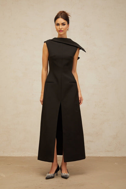 A black midi dress with an open back and deconstructed design featuring Leonore style