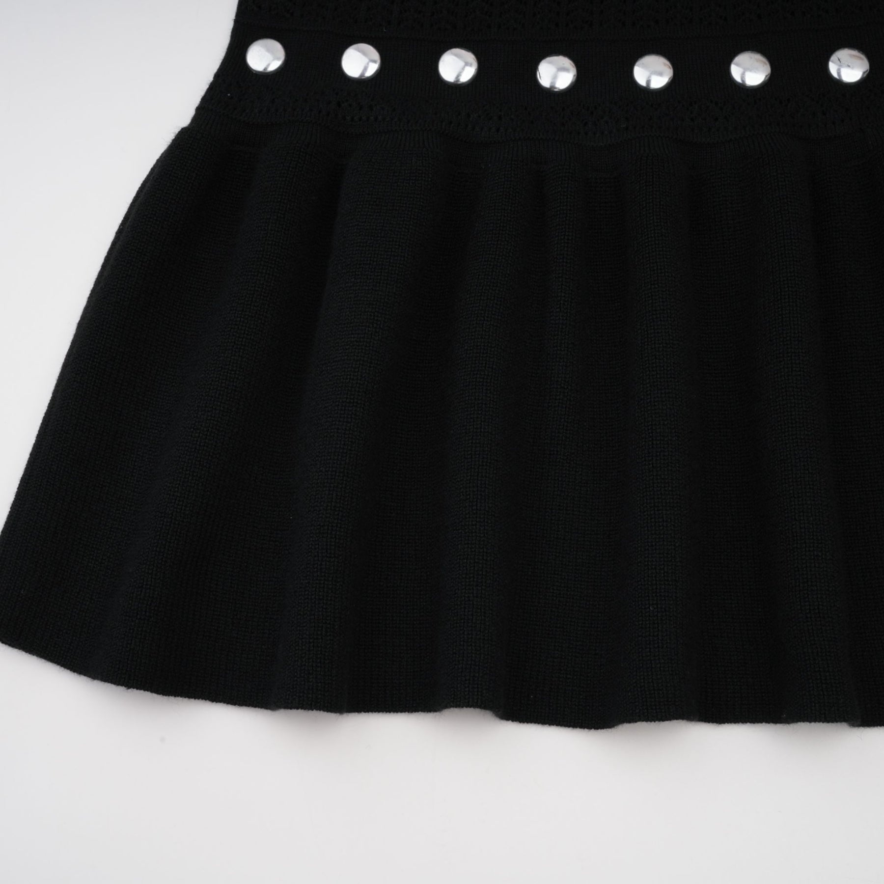 A black Chloe maxi dress with crochet knit detailing and studded embellishments