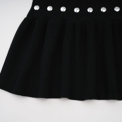 A black Chloe maxi dress with crochet knit detailing and studded embellishments