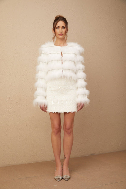 A white padded fur jacket adorned with crystal embellishments in a Margherita floral pattern