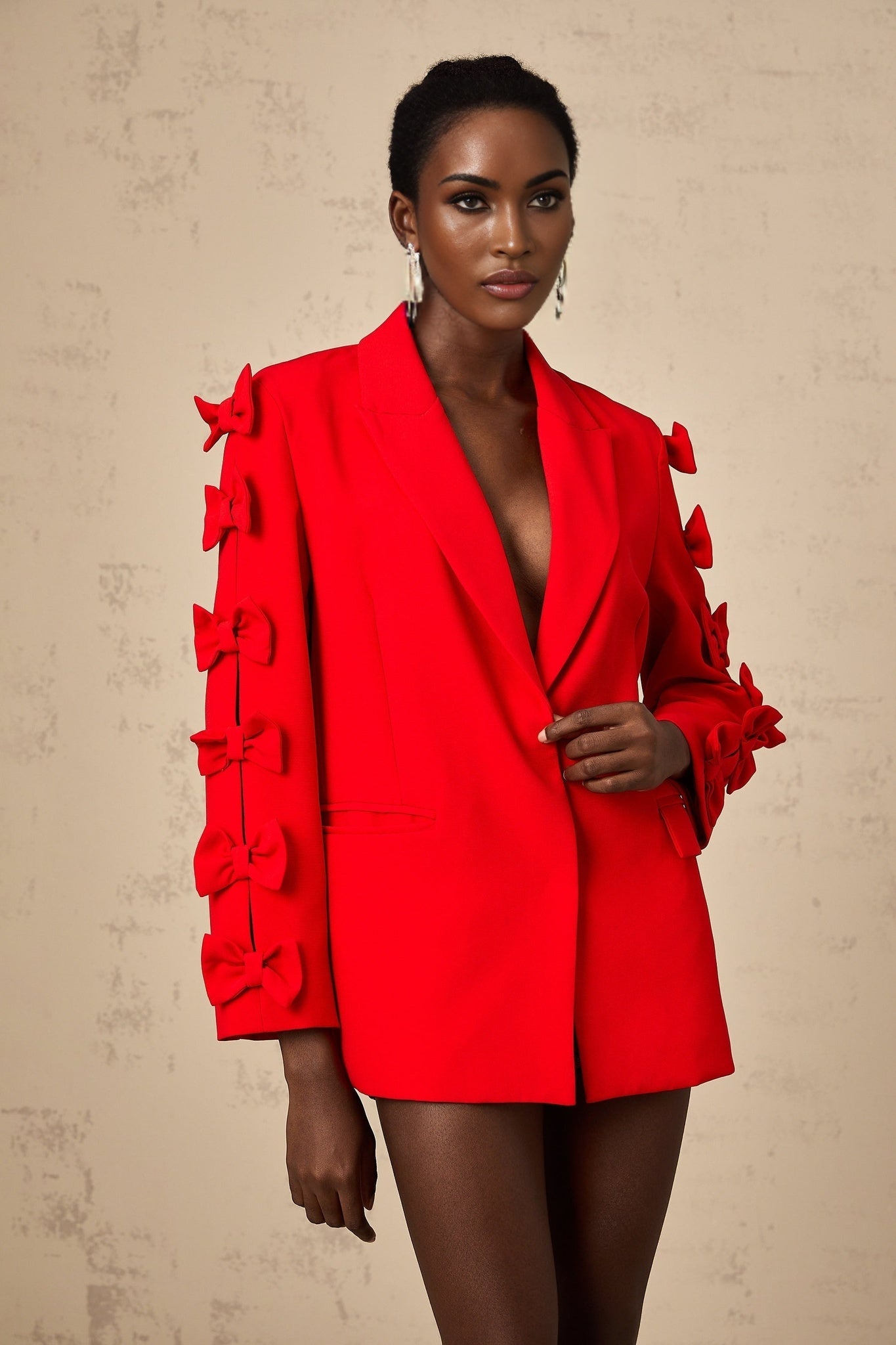 A red blazer with a bowknot detail and cutout design named Bella