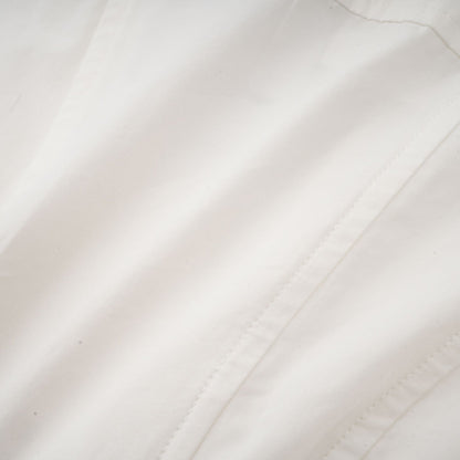 Alt text White pleated mini shirt dress with fitted waist by Orlane