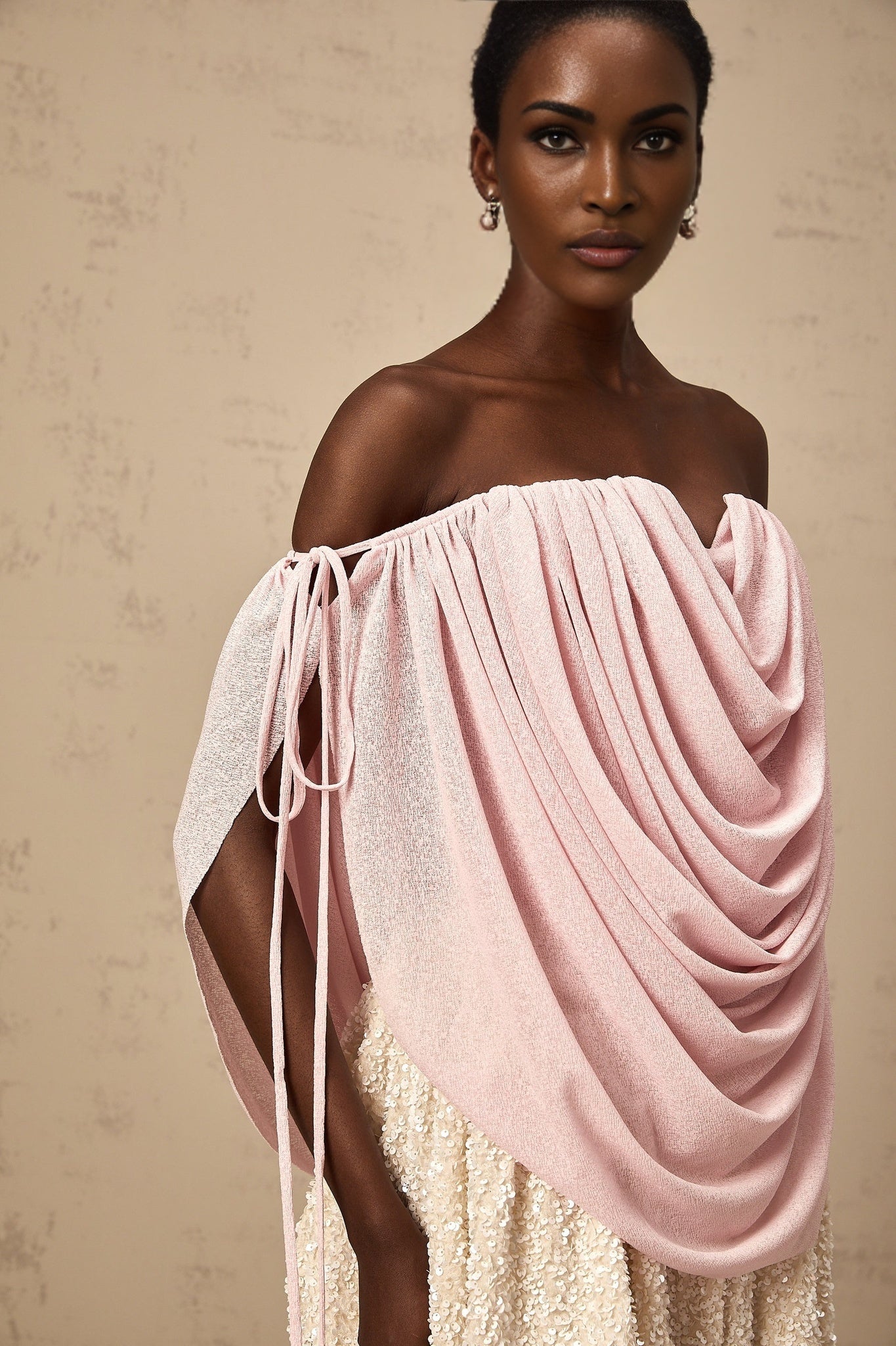 A pink offshoulder top with ruched detailing called Quintina