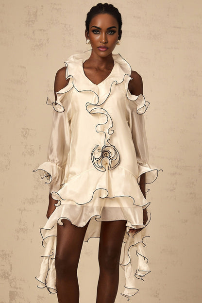 A white mini dress with flounce detailing and ribbon accents named Tiphaine