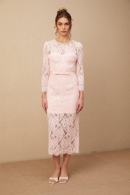 A pink midi dress with floral embroidery and lace details featuring embellishments and a delicate feminine design