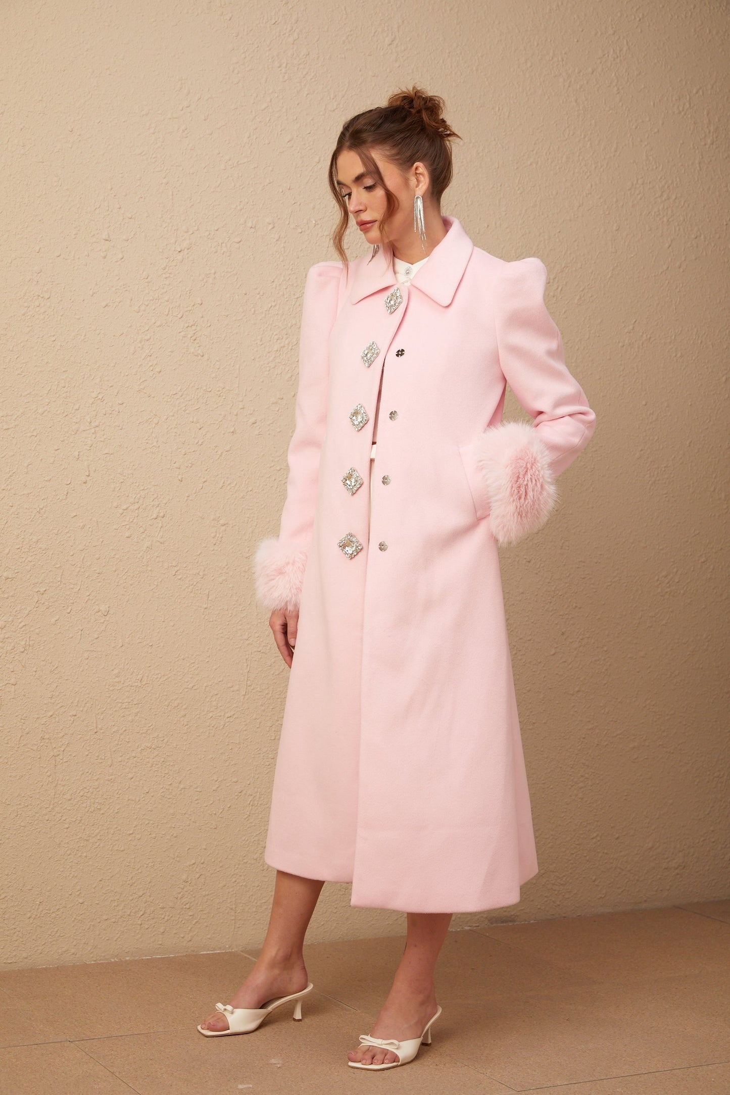 A pink fluffy overcoat with a luxurious faux fur texture named Louisette