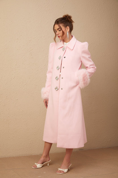 A pink fluffy overcoat with a luxurious faux fur texture named Louisette