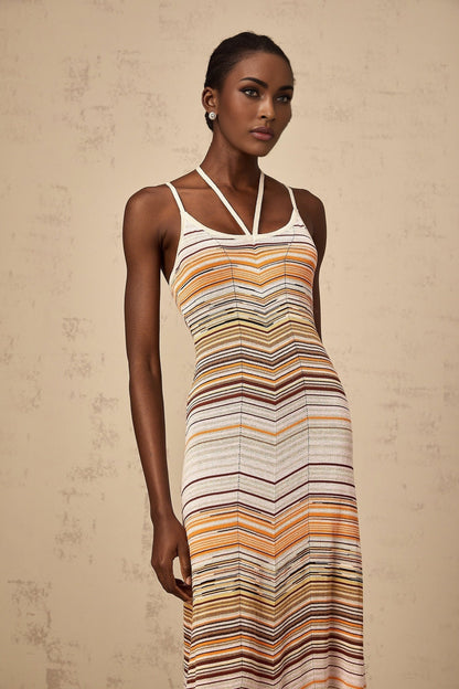 A long striped knit maxi dress from Chloe featuring multiple bright colors in a vertical stripe pattern