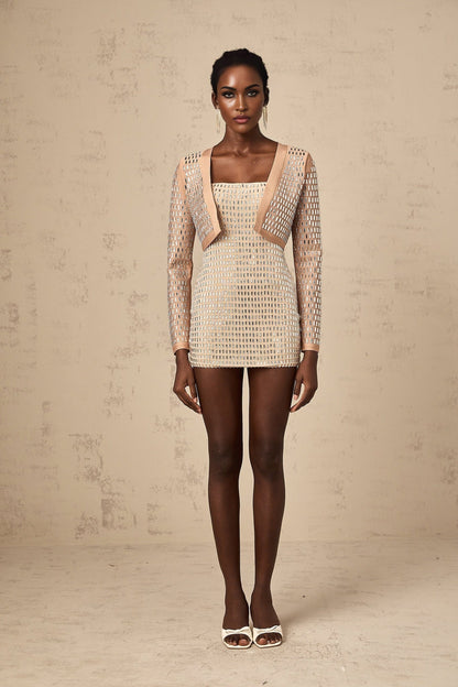 A cropped jacket with a dark background featuring studded embellishments and a boxy silhouette named Ubalda